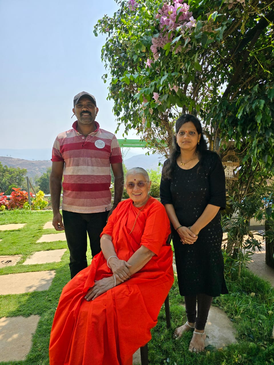 Family relaxing outdoors at Meraki Hillside Villa